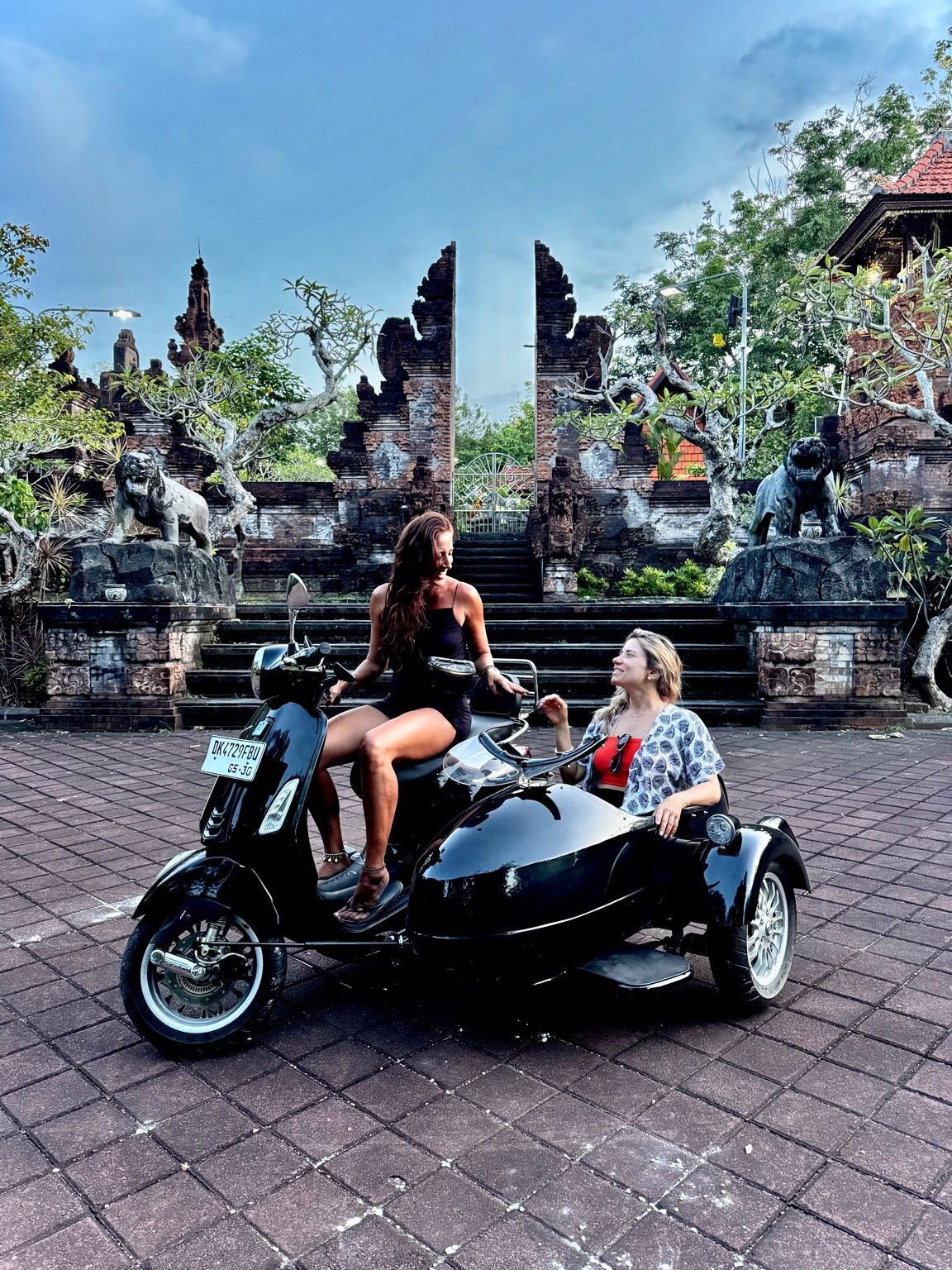 Guests enjoying a Vespa sidecar in Bali