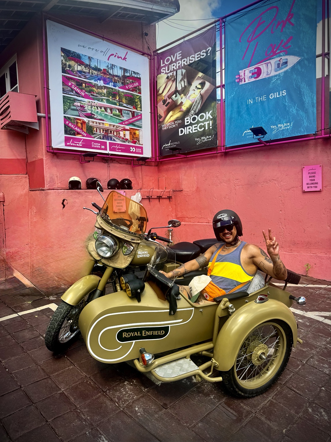 Guest enjoying the Royal Enfield sidecar against a colorful Bali backdrop